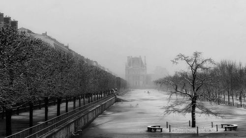 Panoramic view of city during winter against sky