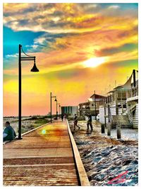 Street against sky during sunset