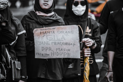 People standing on street in city