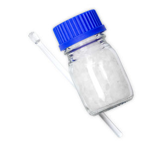 Close-up of empty bottle against white background