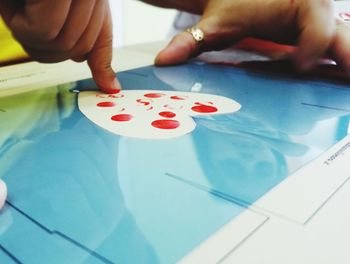 Midsection of man playing with ball on table