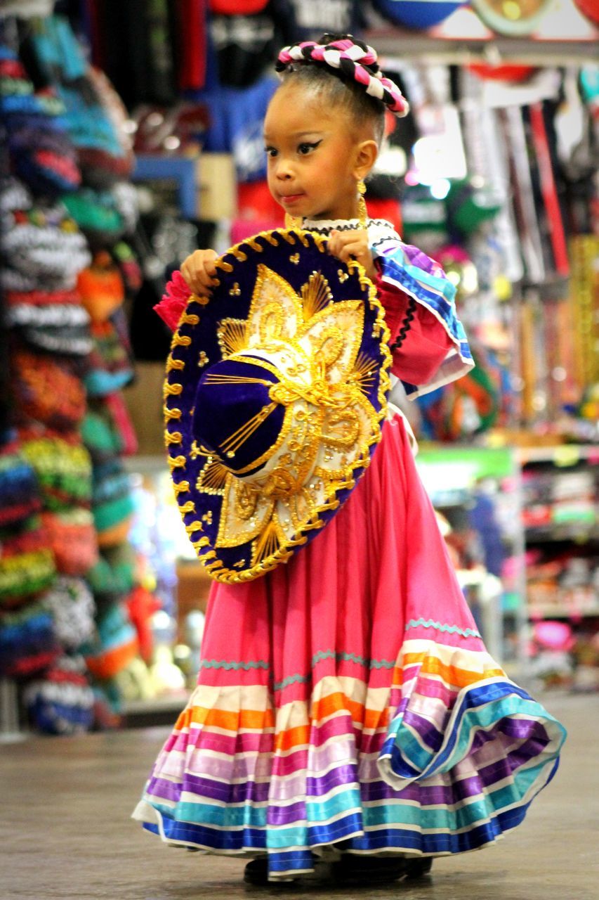 costume, one person, traditional clothing, dancing, focus on foreground, real people, celebration, traditional dancing, clothing, incidental people, multi colored, traditional festival, front view, lifestyles, performance, women, standing, festival, carnival - celebration event