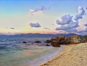 Scenic view of sea against cloudy sky