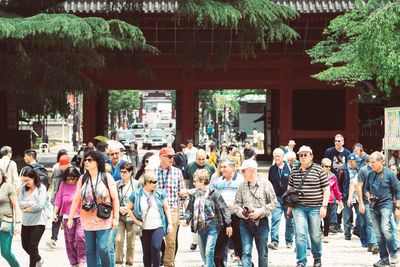 Group of people walking on building