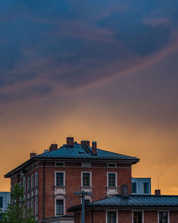 Low angle view of building against sky during sunset