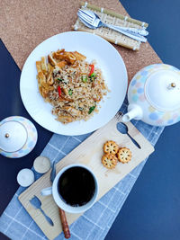 High angle view of food and drink served on table