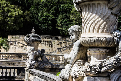 Statue against historic building