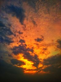 Low angle view of dramatic sky during sunset