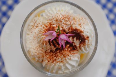 High angle view of purple flower in glass on table