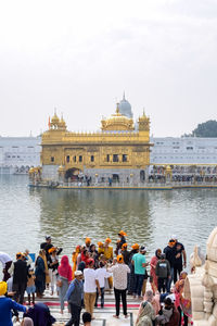 Amritsar, india - february 26 2023 - unidentified devotees from various parts at golden temple