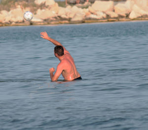 Man playing in sea
