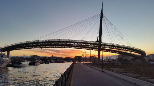 Ponte del mare over aterno-pescara river against sky during sunset