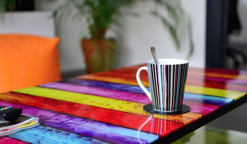 Close-up of coffee cup on table