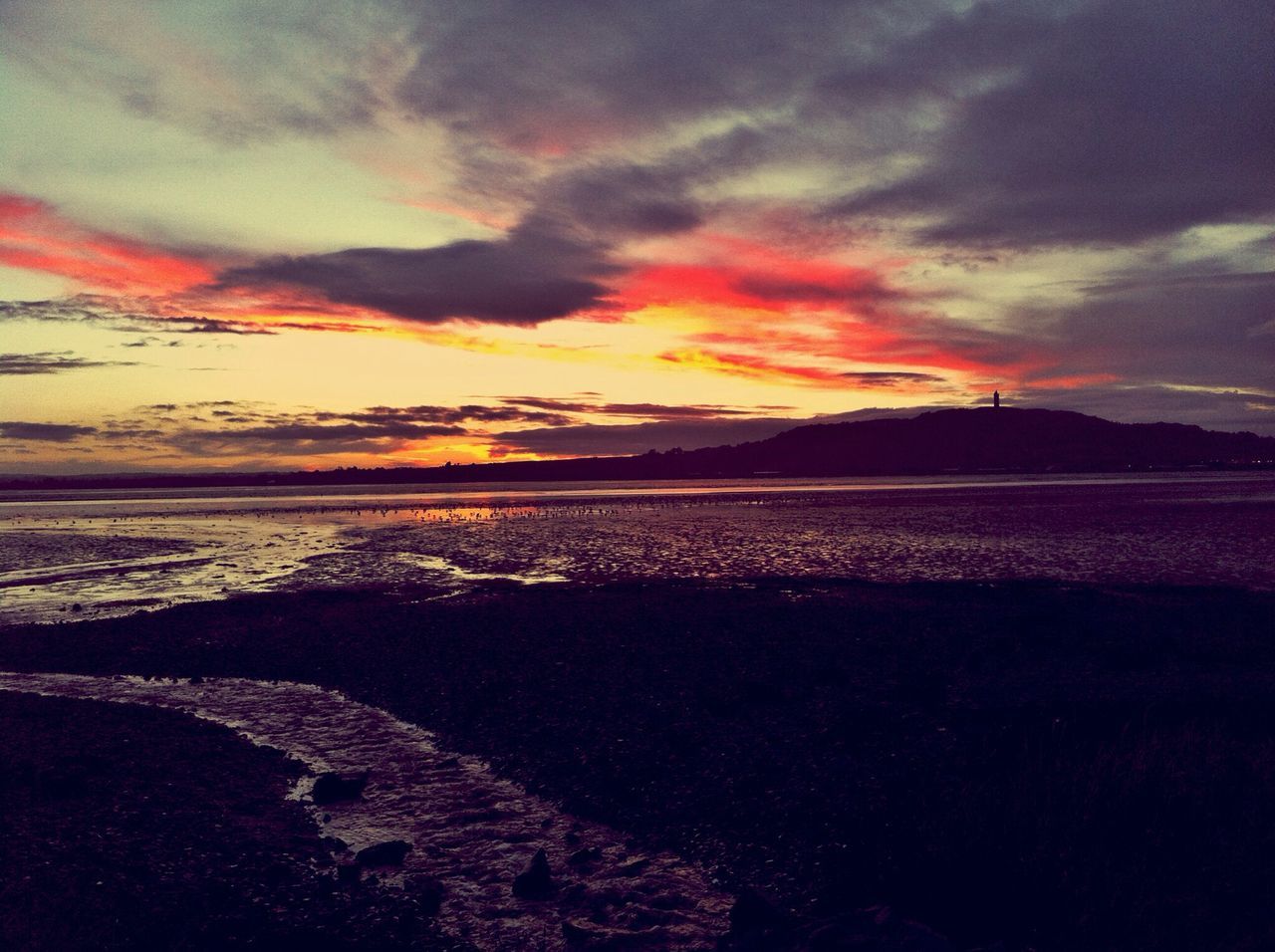 sky, tranquil scene, sunset, scenics, tranquility, beauty in nature, cloud - sky, mountain, water, nature, beach, idyllic, cloud, landscape, sea, orange color, cloudy, dramatic sky, shore, dusk