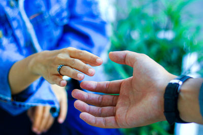 Close-up of man holding hands