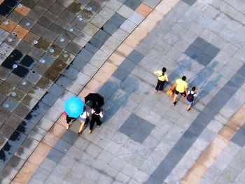 High angle view of people walking on zebra crossing