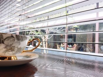 Close-up of coffee cup on table