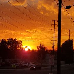 Silhouette trees against sky during sunset