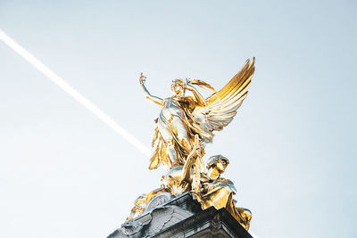 Low angle view of statue against sky