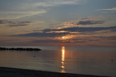 Scenic view of sea against sky at sunset