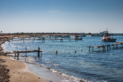 Scenic view of sea against clear blue sky