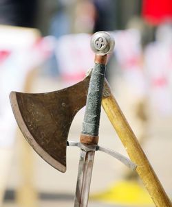 Close-up of axe and sword