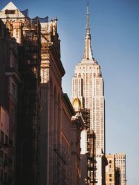 Skyscrapers in city against clear sky