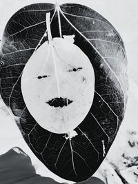 Close-up of person holding umbrella