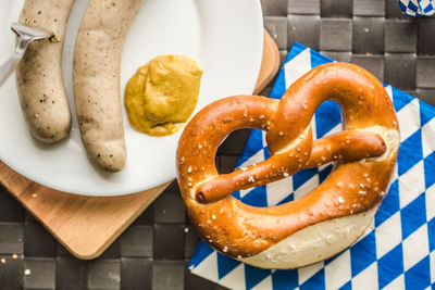 Close-up high angle view of bagel and hot dogs