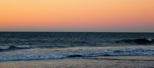 Scenic view of sea at sunset