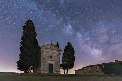 Low angle view of chapel against sky at night