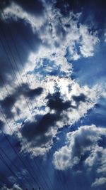 Low angle view of cables against sky