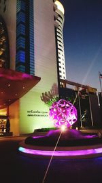 Low angle view of illuminated building at night