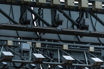 Low angle view of crane against sky