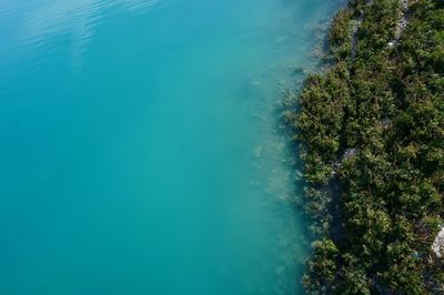 High angle view of turquoise lake from a bridge 