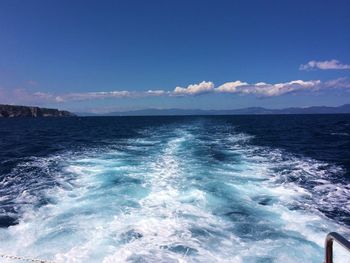 Scenic view of sea against blue sky