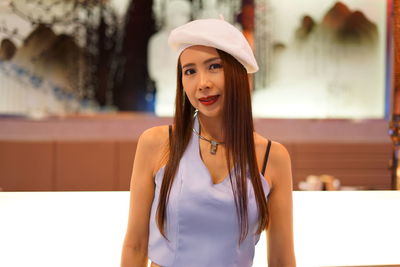 Portrait of smiling woman standing outdoors 