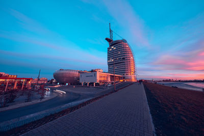 Buildings in city at sunset