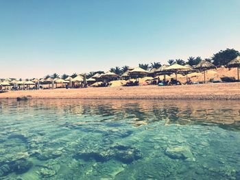 Scenic view of sea against clear blue sky