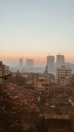 High angle view of buildings against sky during sunset