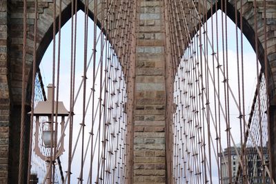 Low angle view of brooklyn bridge in city