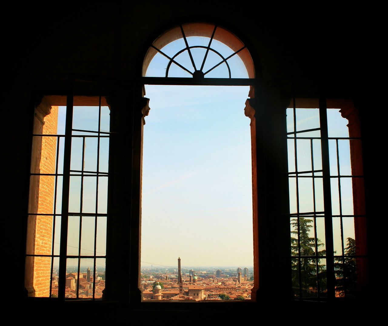 window, indoors, architecture, glass - material, built structure, transparent, day, interior, arch, curtain, no people, window frame, house, sunlight, home interior, old, low angle view, sky, closed, silhouette