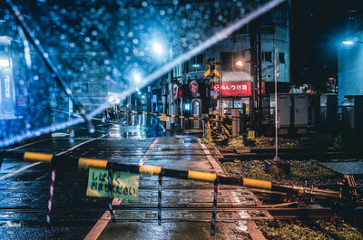 Wet illuminated water at night