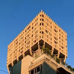 Low angle view of torre velasca against blue sky
