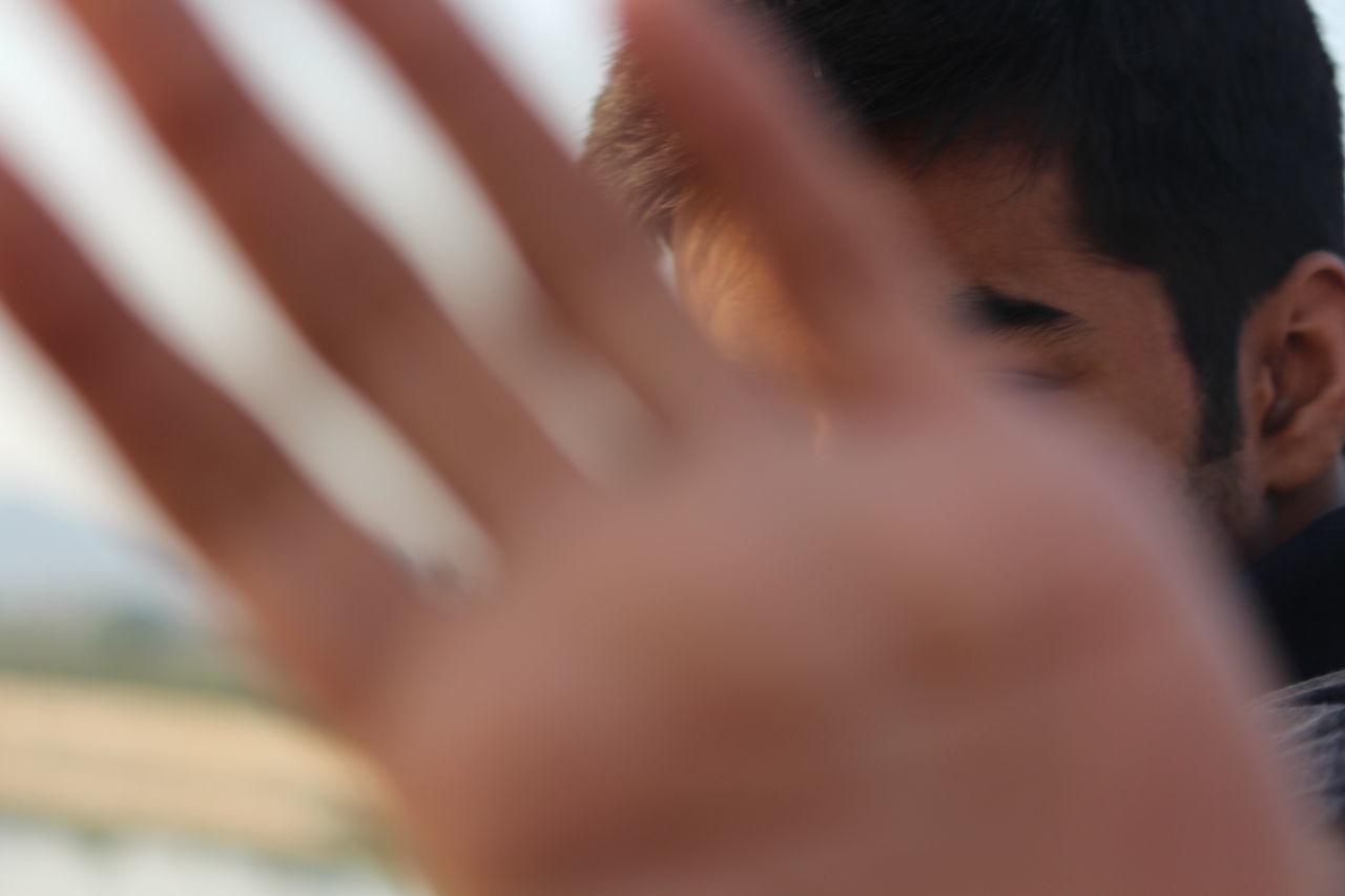 CLOSE-UP OF BABY HAND ON FINGER