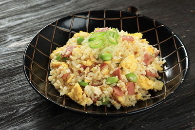 Yakimeshi, japanese fried rice with soy sauce and various topping. close up