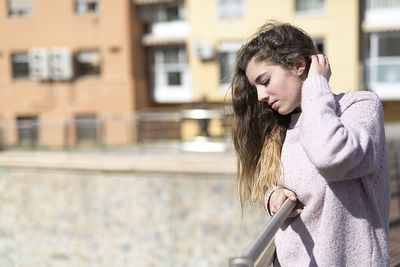 Young woman standing in city