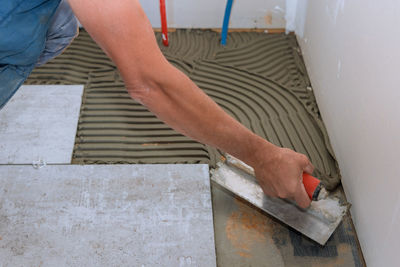 Low section of man working in workshop