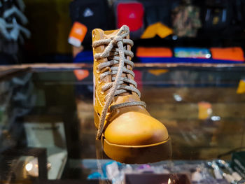 Close-up of shoe on table