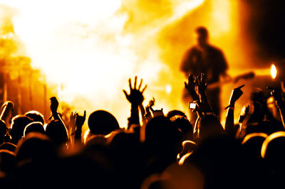 Crowd enjoying at music concert at night